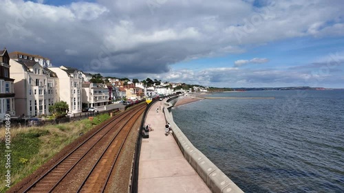 Wallpaper Mural Dawlish Devon England. 01.10.2024. Video.  Red locomotive passing through Dawlish  Devon, UK. Torontodigital.ca