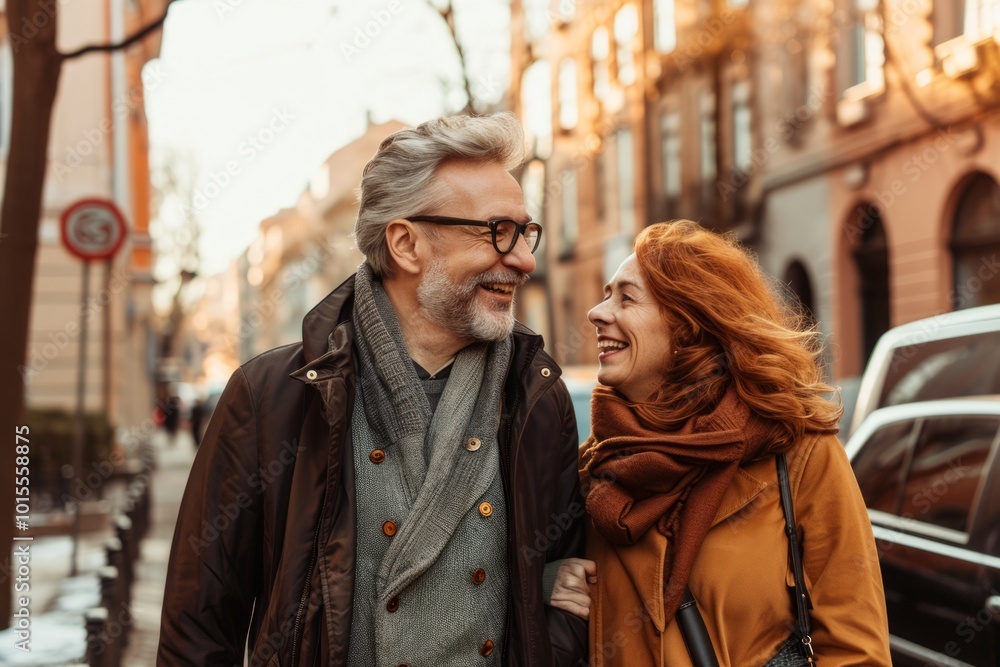 happy senior couple in eyeglasses hugging and smiling on city street happy senior couple in eyeglasses hugging and smiling on city street