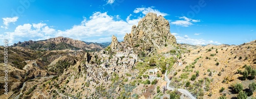 Mountains and Olive groves around Ghost Town from a drone, Pentedattilo Village, Calabria, Italy, Europe photo