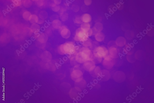 Pink blurred lights on violet blue gradient backdrop, bokeh effect. Halloween background