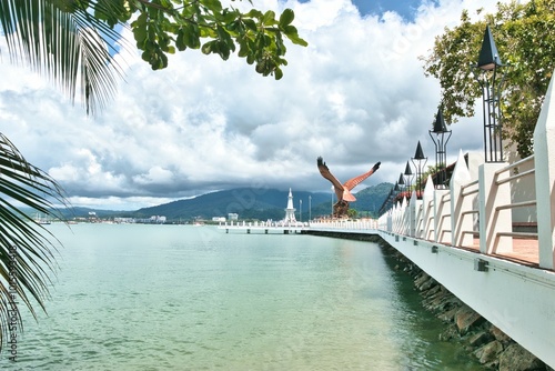 Langkawi, Malaysia - October 04, 2024: The Eagle of Langkawi. Landmark of the Malaysian Island. Huge statue of an eagle at the Eagle Square near the Kuah. This was on a hot sunny day in wet season. photo