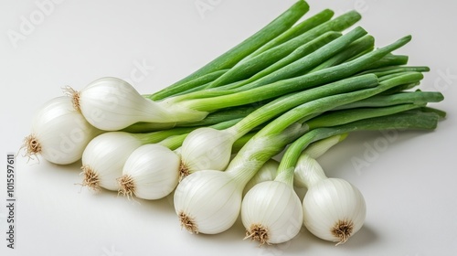 A bunch of fresh green onions on a white background.