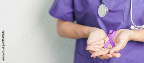 Doctor holding purple Ribbon for Violence, Pancreatic, Esophageal, Testicular cancer, Alzheimer, epilepsy, lupus, Sarcoidosis and Fibromyalgia. Awareness month and World cancer day concept photo