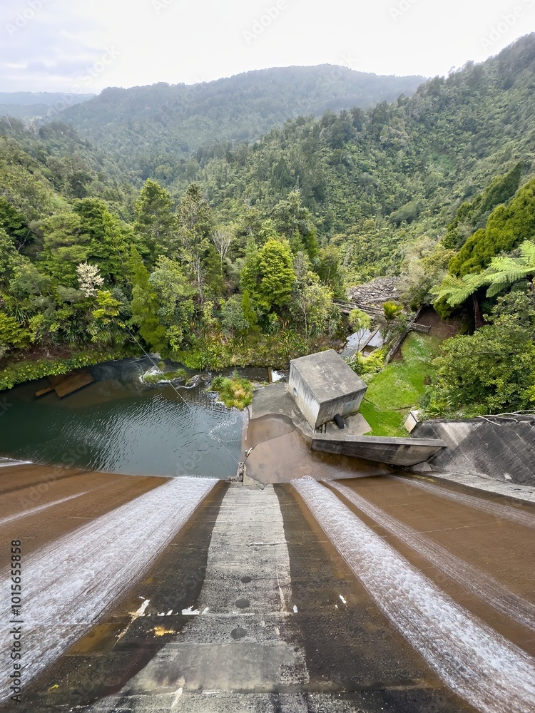 Fototapeta premium Water flowing over the Waitakere Reservoir Dam, Waitakeres, Auckland, Auckland, New Zealand.