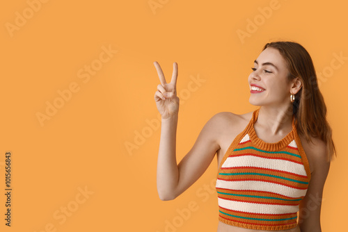 Pretty young woman showing ...