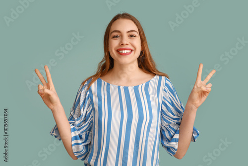 Pretty young woman showing ...