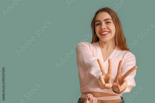 Pretty young woman showing ...