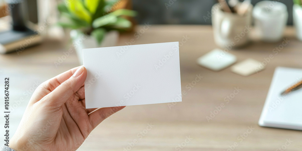 Obraz premium Close up of a hand holding a blank business card mockup, generative AI
