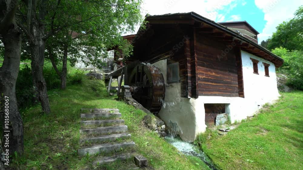 Old traditional water mill where flour for bread is made. Old building - static shot Old traditional water mill where flour for bread is made. Old building - static shot
