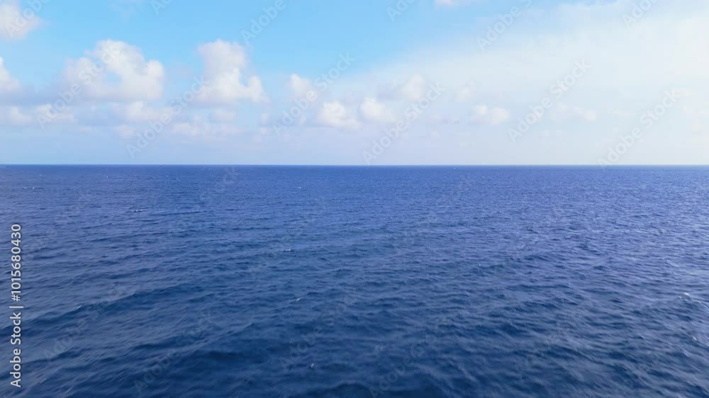 Wide ocean view under a bright sky with gentle ripples on the surface, calm and serene seascape Wide ocean view under a bright sky with gentle ripples on the surface, calm and serene seascape