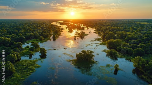 Aerial view of floodplains filled with water after heavy rains, with flooded areas along the river.