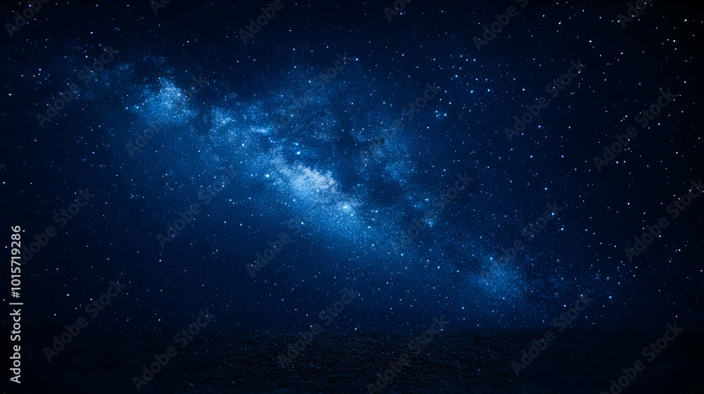 Fototapeta premium A Stunning Night Sky with the Milky Way Galaxy Shining Brightly Above a Dark Ground