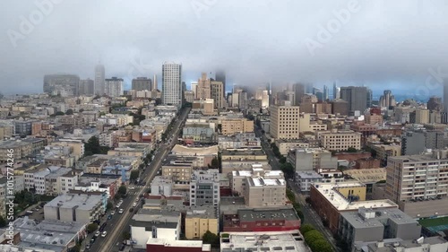 Time-Lapse of Dense Fog Drifting Over San Francisco Financial District Buildings. California, USA.  photo