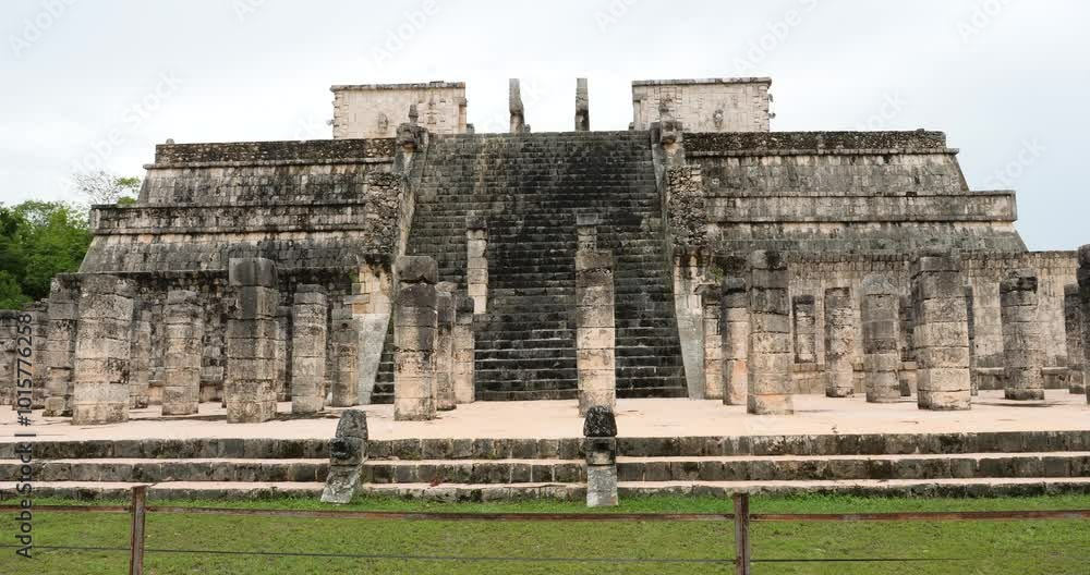 The Temple of the Warriors in Chichen Itza is located in the Grand Plaza right next to the Temple of the Tables and to the right of the main side of the Kukulkán Pyramid. The Temple of the Warriors in Chichen Itza is located in the Grand Plaza right next to the Temple of the Tables and to the right of the main side of the Kukulkán Pyramid.