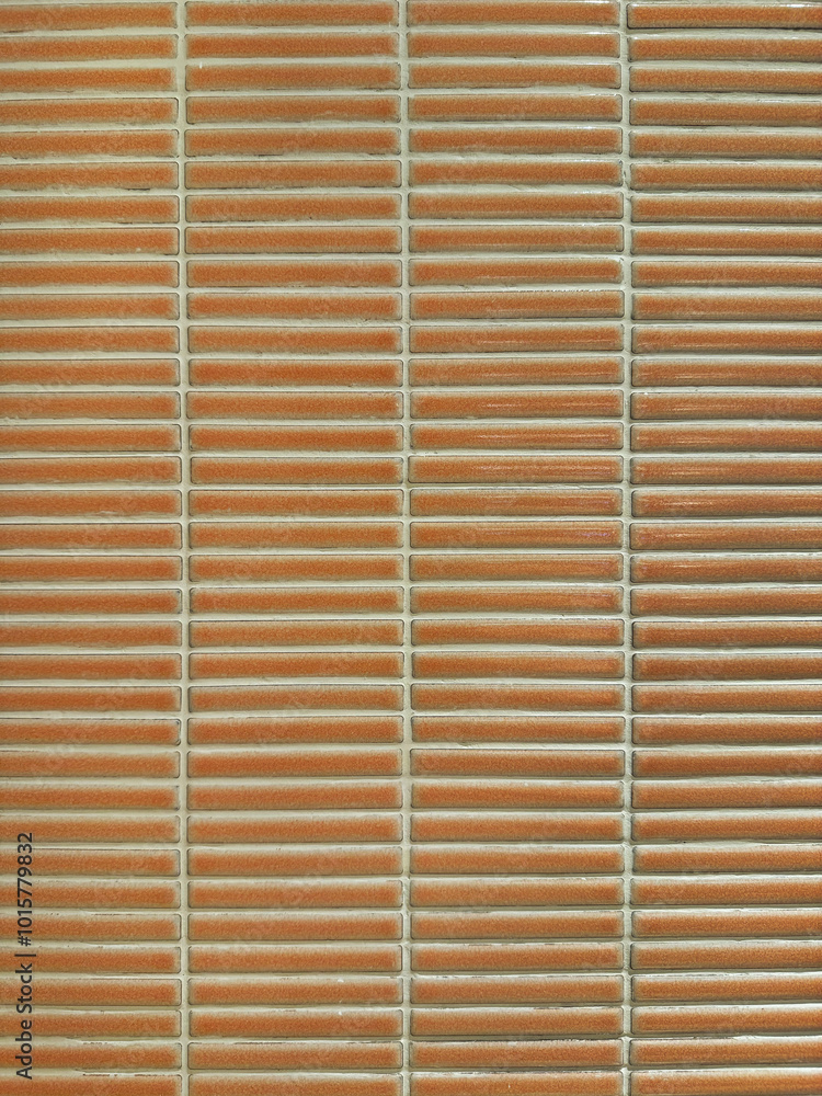 Horizontal orange and clay subway tiles with white grouts. Seamless tiles background texture. Horizontal orange and clay subway tiles with white grouts. Seamless tiles background texture.