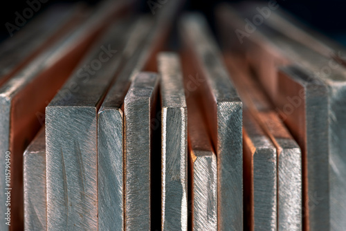 Row of copper flat bars close-up, product of the non-ferrous metals industry