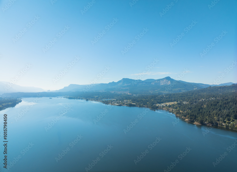 A beautiful blue lake with mountains in the background A beautiful blue lake with mountains in the background