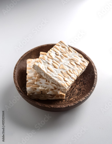 Raw tempeh or tempe on a white background