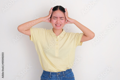 A woman touching her head showing stressed gesture photo