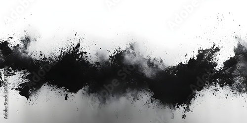 Abstract black ink splatters on a white background, creating a dynamic and artistic composition.