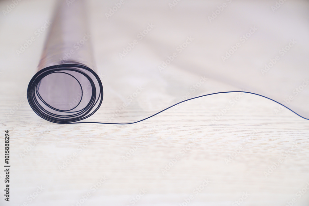A roll of transparent PVC film to protect surfaces. Thermoplastic polyvinyl chloride made on the basis of granular polymer. A roll of transparent PVC film to protect surfaces. Thermoplastic polyvinyl chloride made on the basis of granular polymer.