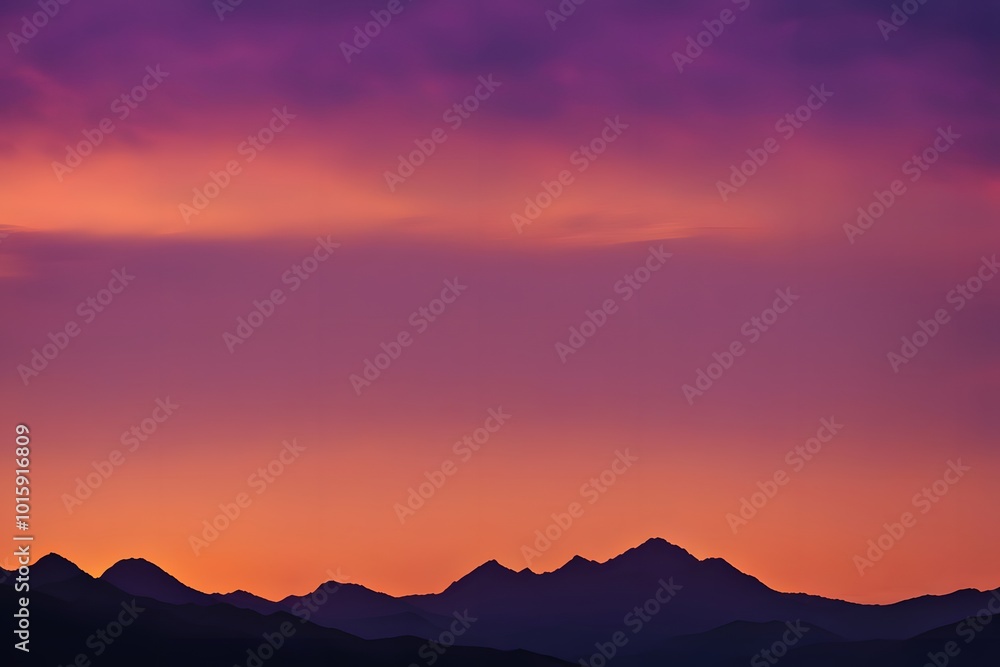 Obraz premium Silhouette of mountain ranges against a bright orange and purple sunset glow, Ai Generated