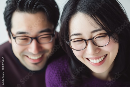 a couple dressed in matching purple on a white background with above view shot. Their posture symbolize unity, harmony, making it a heartwarming depiction of a lasting relationship.