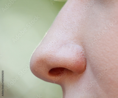 Obraz na plátně A woman's nose is shown in detail, with the nostrils