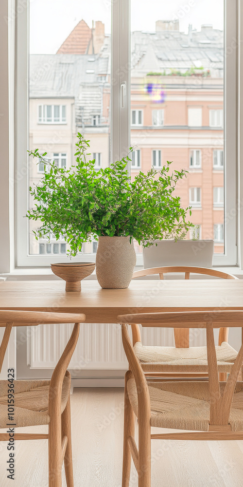 Bright and airy dining area with plants and a view of city buildings in the background Bright and airy dining area with plants and a view of city buildings in the background