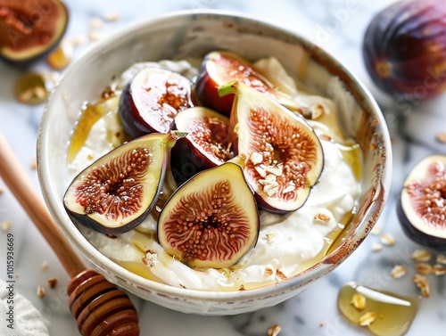 A bowl of Greek yogurt topped with sliced figs and a drizzle of honey