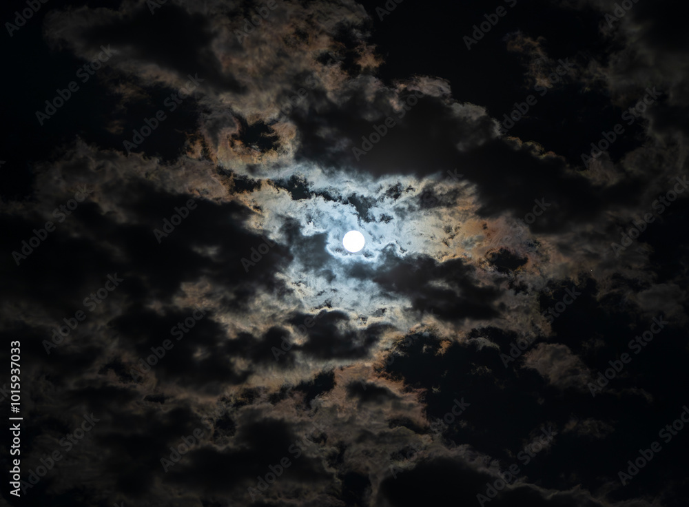 The beautiful dominant of the night sky is the full moon. It stands out even more beautifully among the illuminated clouds. The beautiful dominant of the night sky is the full moon. It stands out even more beautifully among the illuminated clouds.
