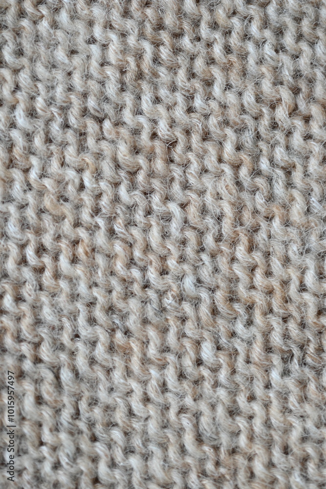 texture of knitted light brown sweater, close-up texture of beige knitted fabric, macro texture of tan knitted woolen clothes texture of knitted light brown sweater, close-up texture of beige knitted fabric, macro texture of tan knitted woolen clothes
