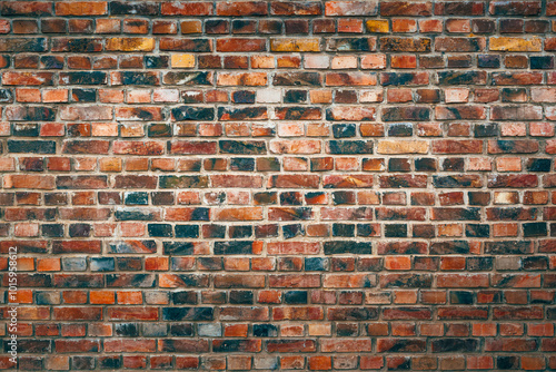 Texture of a beautiful clinker brick wall pattern. Rustic facade with vibrant color. photo