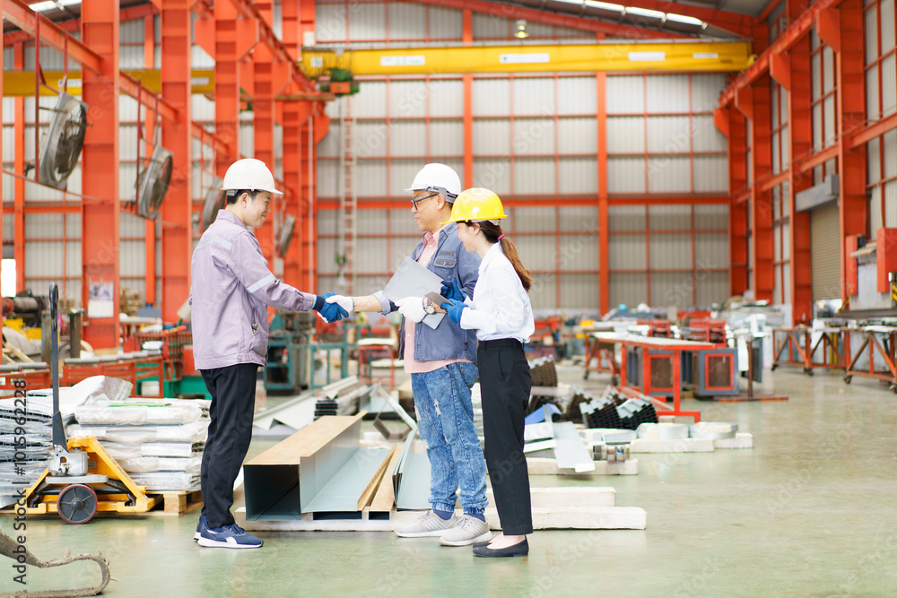 Industrial engineer team works together in factory. Industrial engineer team works together in factory.