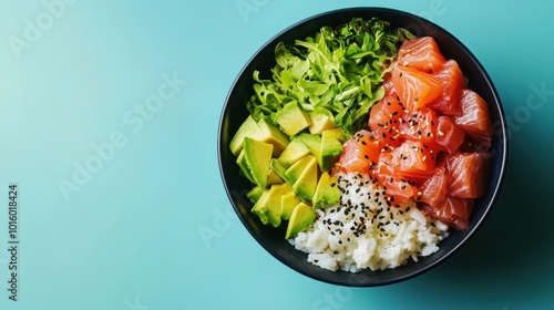 Close-up of a vibrant poke bowl filled with fresh tuna, avocado, and rice, set against a minimalist blue background