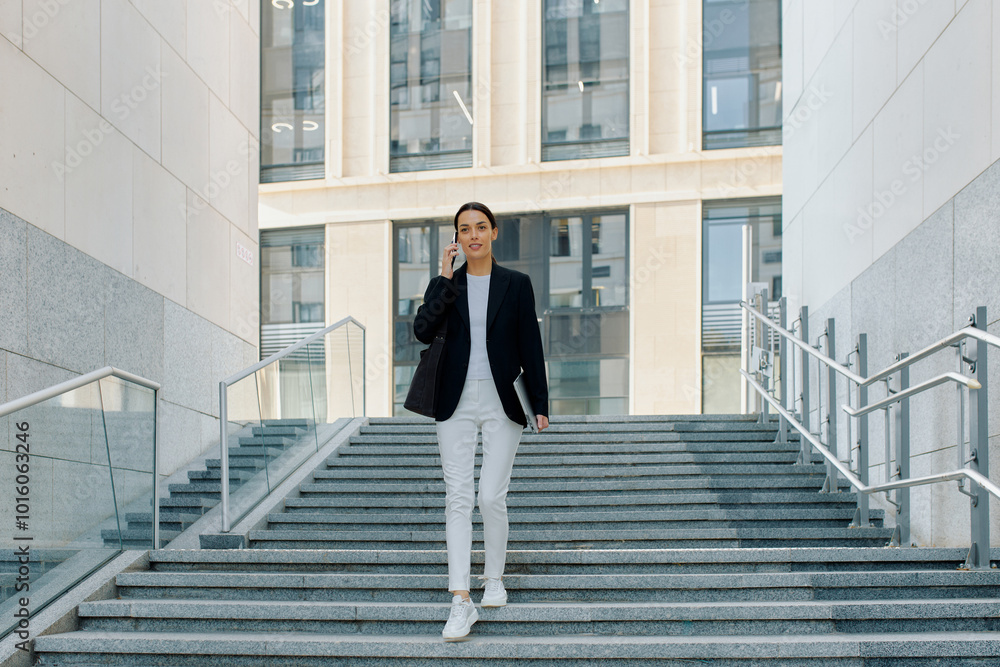 Job interview concept, young woman approaching central office to meet potential employer Job interview concept, young woman approaching central office to meet potential employer