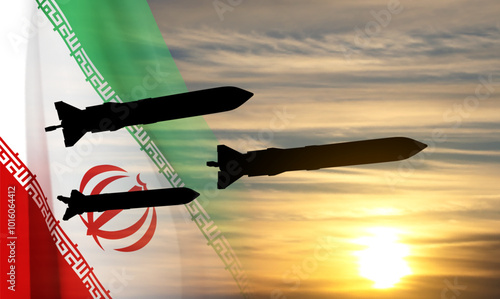 Silhouette of missiles with Iran flag against the sunset. EPS10 vector
