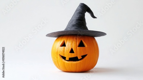 Halloween pumpkin wearing a witch hat on a white background