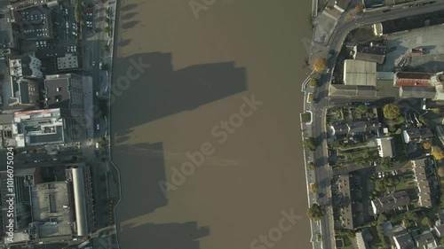 Limerick city and shannon river with morning sunlight casting long shadows, aerial view photo