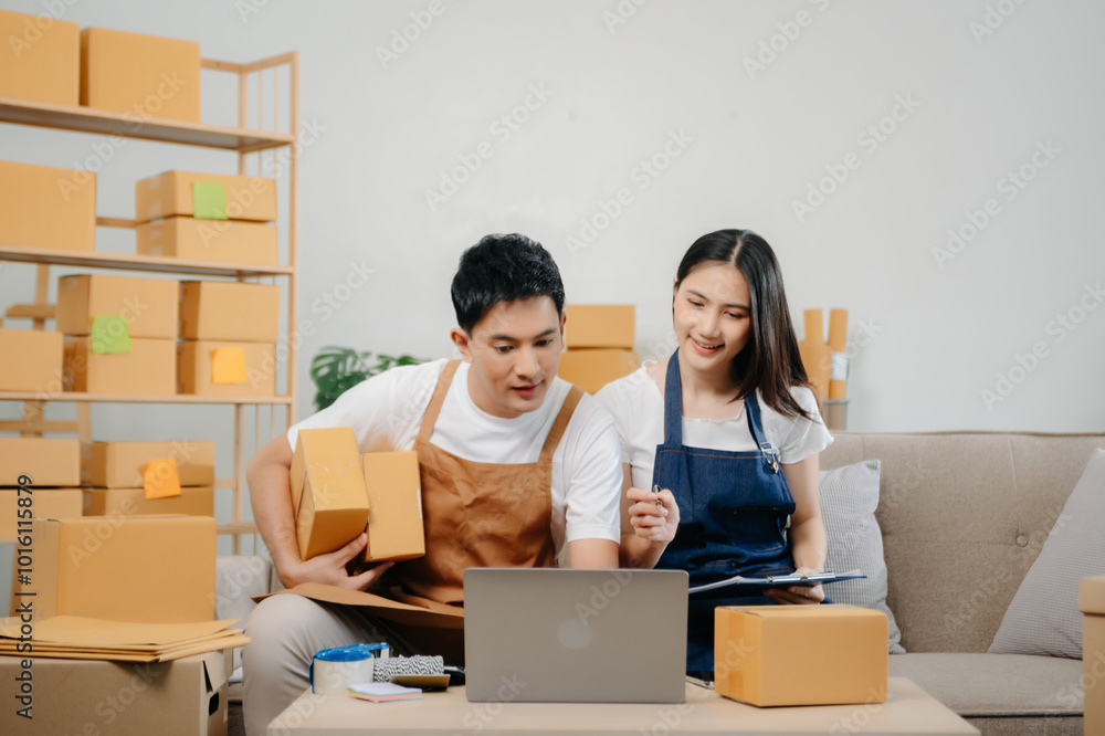 Small business entrepreneur SME freelance Asian man and woman working at home office, BOX, tablet and laptop online, marketing, packaging, delivery. Small business entrepreneur SME freelance Asian man and woman working at home office, BOX, tablet and laptop online, marketing, packaging, delivery.