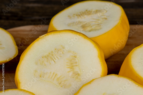 cut yellow ripe pumpkins on the table in close-up