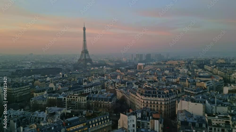 Paris cityscape with Tour Eiffel and Montparnasse tower in background at sunrise, Skyline early in the morning. Aerial drone ascending and cityscape