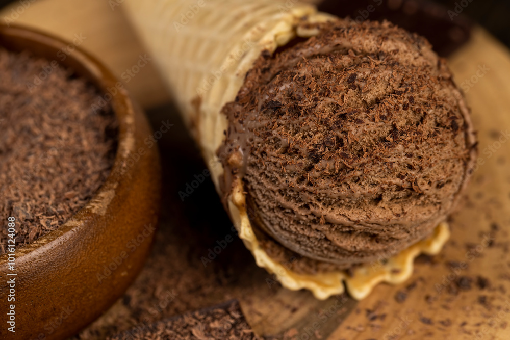 chocolate ice cream in a cone on a board chocolate ice cream in a cone on a board