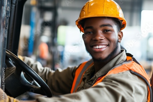 A forklift driver is captured smiling broadly, dressed in industrial safety apparel, emphasizing the importance of safety and satisfaction in the workplace. photo