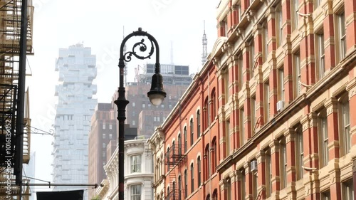 New York City Manhattan Soho fashion district near Broadway street. USA urban building facade, old american architecture. Shopping in NYC, United States. Business and residential real estate. Lantern photo