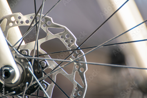 Photos detail of the brake disc of a front wheel of a road racing bicycle