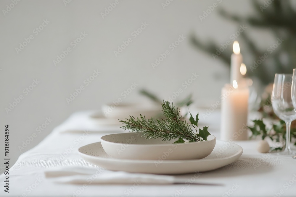 A serene and minimalist white dining table features evergreen branches and candles, conveying a peaceful and elegant holiday ambiance in a simple setting. A serene and minimalist white dining table features evergreen branches and candles, conveying a peaceful and elegant holiday ambiance in a simple setting.