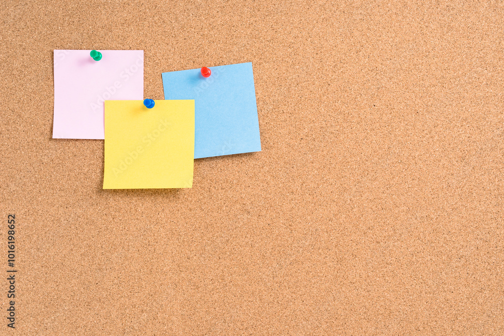 Cork board with colorful blank notes