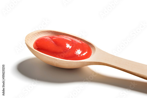 Wooden spoon of ketchup on white background, close up