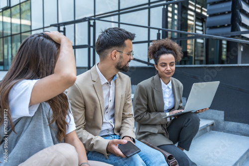 Group of young businesspeople stock market and exchange experts, leaders in modern science, finance and economy standing outside of office building. Staff members meeting businessman and businesswoman